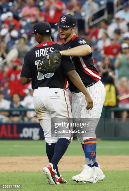 Ke'Bryan Hayes of the Pittsburgh Pirates and the U.S. Team celebrates with teammates after defeating the World Team during the SiriusXM All-Star...