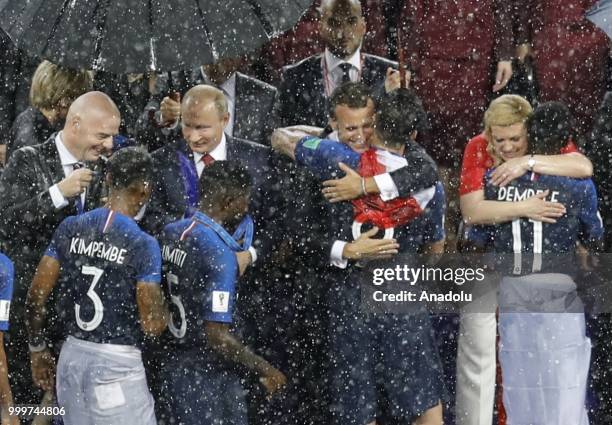 Croatian players shake hands with Russian President Vladimir Putin, Croatian President Kolinda Grabar Kitarovic, French President Emmanuel Macron and...