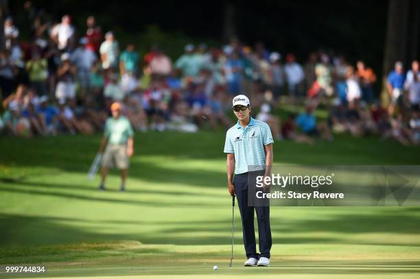 Michael Kim lines up a putt on the 18th green during the final round of the John Deere Classic at TPC Deere Run on July 15, 2018 in Silvis, Illinois.