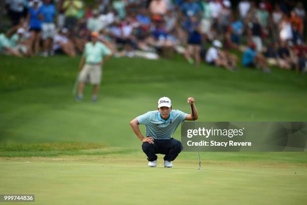 Michael Kim lines up a putt on the 18th green during the final round of the John Deere Classic at TPC Deere Run on July 15, 2018 in Silvis, Illinois.