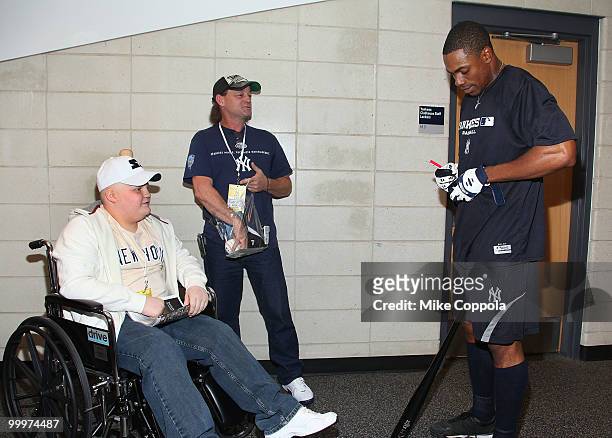 Jack Williams, Roger Williams, and New York Yankees left fielder Marcus Thames attend the starter event at NY Yankees batting practice at Yankee...