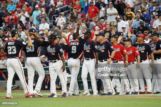 The U.S. Team celebrates after defeating the World Team in the SiriusXM All-Star Futures Game at Nationals Park on July 15, 2018 in Washington, DC.