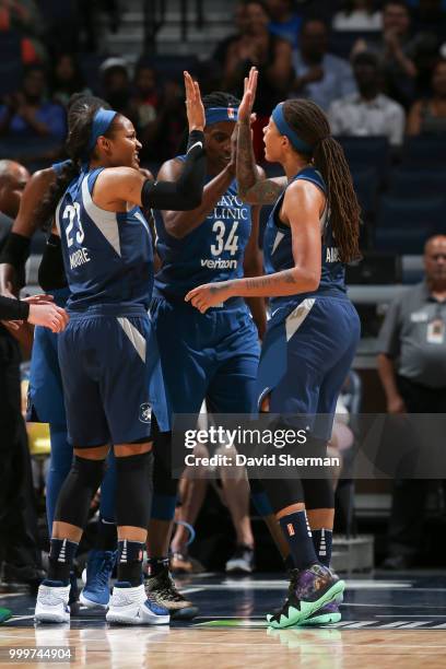 Maya Moore, Sylvia Fowles and Seimone Augustus of the Minnesota Lynx react during game against the Connecticut Sun on July 15, 2018 at Target Center...