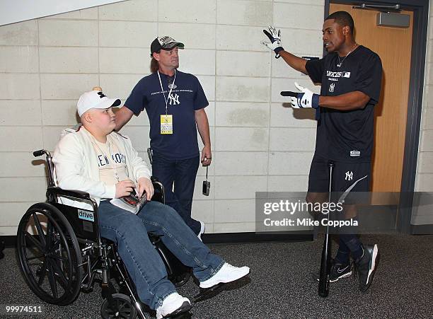 Jack Williams, Roger Williams, and New York Yankees left fielder Marcus Thames attend the starter event at NY Yankees batting practice at Yankee...