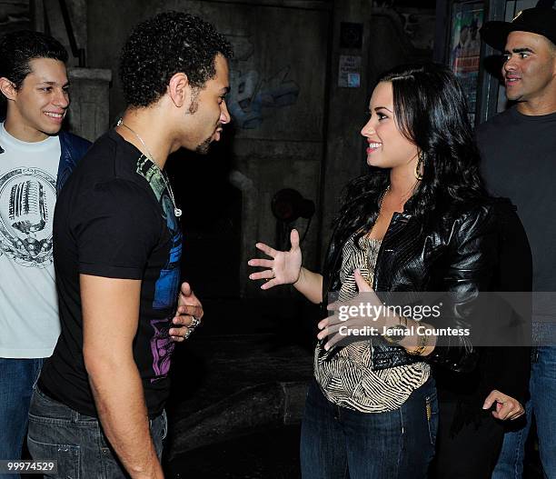 Singer/actor Corbin Bleu and the cast of "In The Heights" greet singer/actress Demi Lovato backstage after a performance of "In The Heights" at...