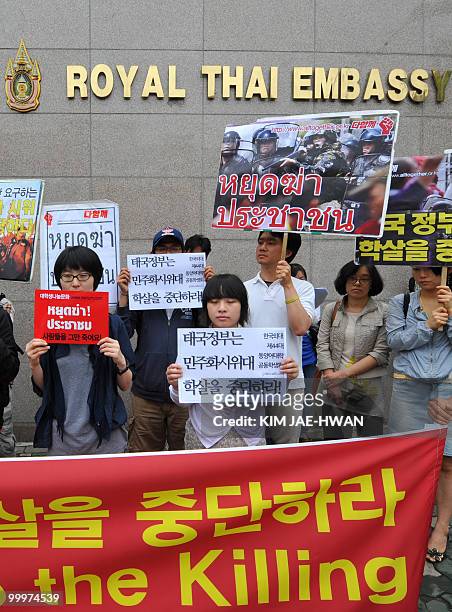 South Korean rights activists hold pickets in front of the Thai embassy in Seoul on May 19 demanding the Thai government should stop crackdowns on...