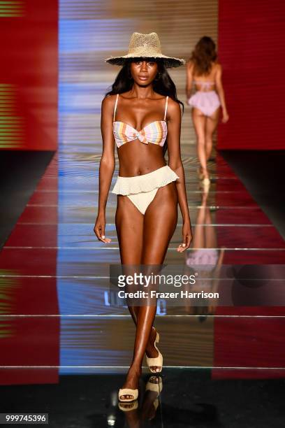 Model walks the runway for Montce Swim Resort Spring 2019 during the Paraiso Fasion Fair at The Paraiso Tent on July 15, 2018 in Miami Beach, Florida.
