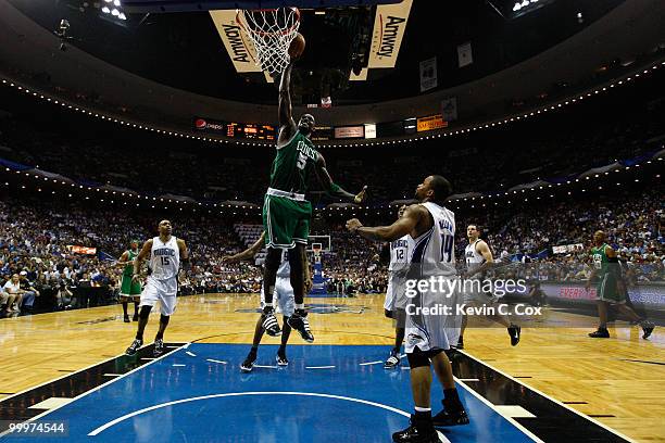 Kevin Garnett of the Boston Celtics drives for a dunk attempt against Jameer Nelson of the Orlando Magic in Game Two of the Eastern Conference Finals...