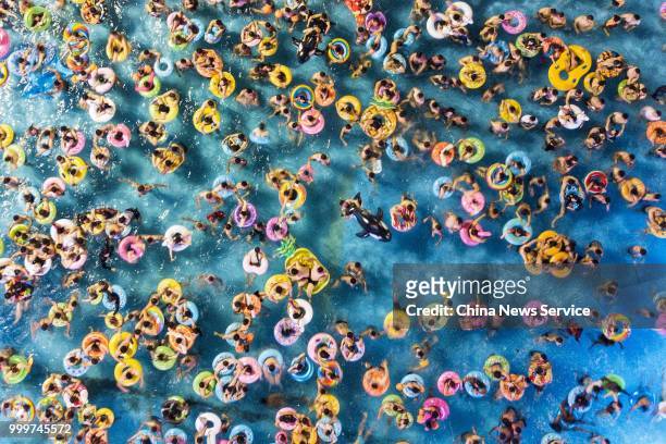 Aerial view of citizens enjoying cool moments at a water park on July 13, 2018 in Nanjing, Jiangsu Province of China. According to the Central...