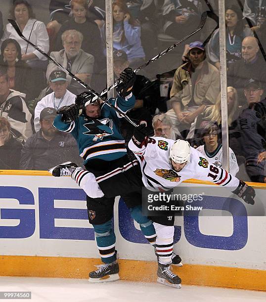 Andrew Ladd of the Chicago Blackhawks checks Douglas Murray of the San Jose Sharks in Game Two of the Western Conference Finals during the 2010 NHL...