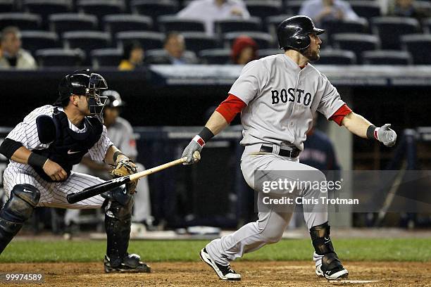Jeremy Hermida of the Boston Red Sox hits a two-run double in the ninth inning against the New York Yankees on May 18, 2010 at Yankee Stadium in the...