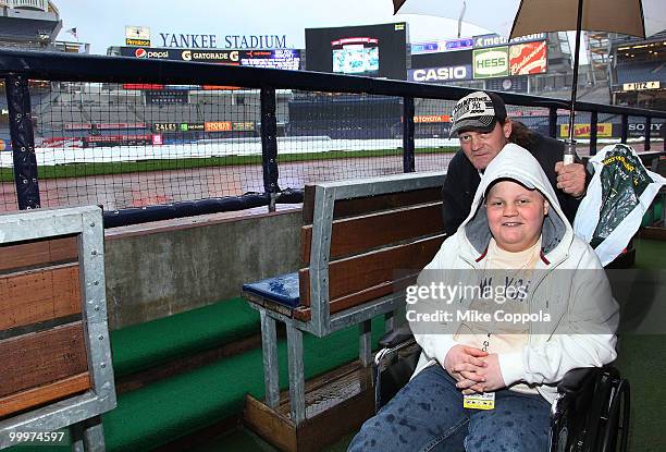 Jack Williams and Roger Williams pose for a picture in the New York Yankees dugout at the starter event at NY Yankees batting practice at Yankee...