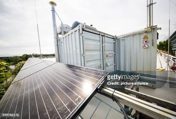 The sun shines on a photovoltaic installation on the roof of the Fraunhofer Institute for Industrial Engineering in Stuttgart, Germany, 4 September...