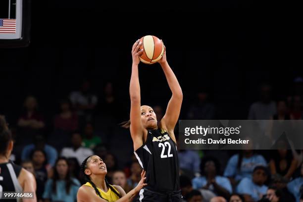Ja Wilson of the Las Vegas Aces handles the ball against Candace Parker of the Los Angeles Sparks on July 15, 2018 at the Mandalay Bay Events Center...