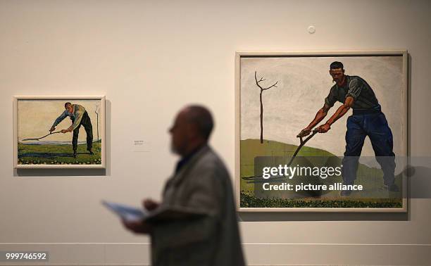Man walks past Ferdinand Holdler's painting 'Der Maer' in the Federal Art Hall in Bonn, Germany, 7 September 2017. The gallery is currently hosting a...