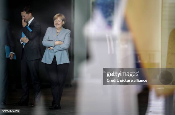 German chancellor Angela Merkel with government spokesman Steffen Seibert ahead of recieving Israeli president Rivlin outside the state chancellery...