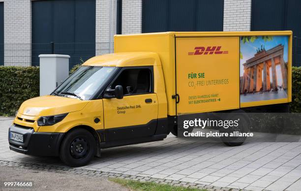 An emission-free post van belonging to the German Post DHL Group during a press conference hosted by the Ministry of Environmental Affairs in Berlin,...