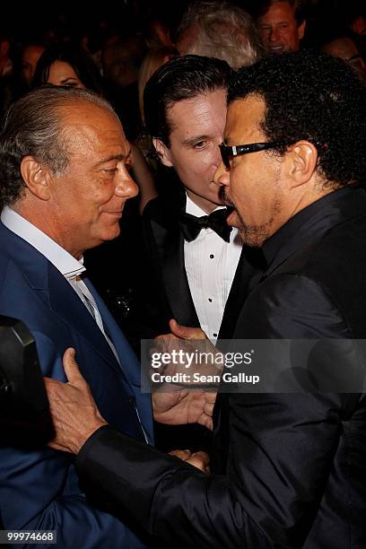 Fawaz Gruosi and Lionel Richie talk as they attend the de Grisogono cocktail party at the Hotel Du Cap on May 18, 2010 in Cap D'Antibes, France.