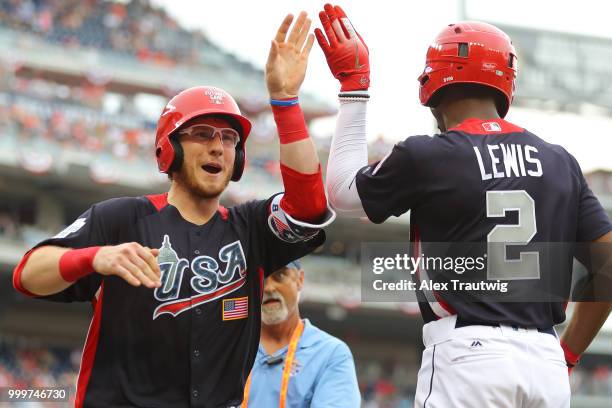 Danny Jansen of Team USA is congratulated by Kyle Lewis of Team USA after hitting a home run in the fourth inning during the SiriusXM All-Star...