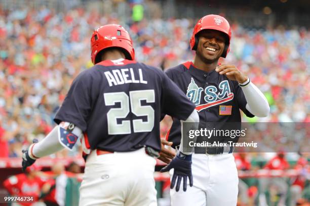 Ke'Bryan Hayes of Team USA is congratulated on his fourth-inning home run by Jo Adell during the SiriusXM All-Star Futures Game at Nationals Park on...