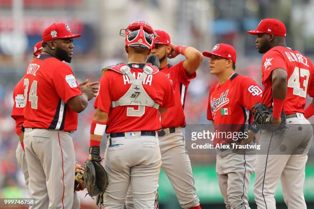 David Ortiz of the World Team visits the pitcher's mound during the SiriusXM All-Star Futures Game at Nationals Park on Sunday, July 15, 2018 in...