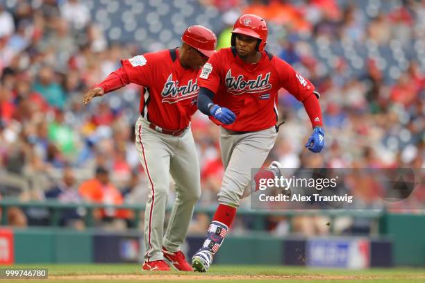 Yusniel Diaz of the World Team rounds the bases after a fifth-inning home run during the SiriusXM All-Star Futures Game at Nationals Park on Sunday,...