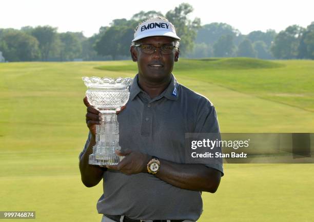Vijay Singh poses with the winner's trophy after beating Jeff Maggert in a two hole playoff during the final round of the PGA TOUR Champions...