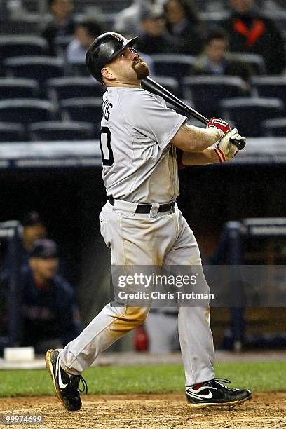 Kevin Youkilis of the Boston Red Sox hits a one-run single in the eighth inning against the New York Yankees on May 18, 2010 at Yankee Stadium in the...