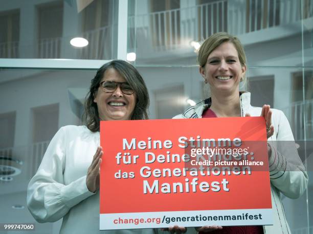 Claudia Langer , the founder of Generation Manifest, and Maja Goepel, general secretary of the Scientific Council on Global Climate Change, hold a...