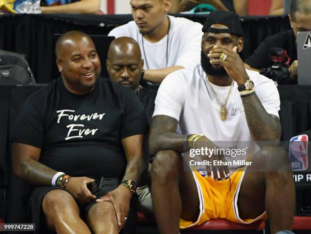 Randy Mims and LeBron James of the Los Angeles Lakers laugh as they attend a quarterfinal game of the 2018 NBA Summer League between the Lakers and...