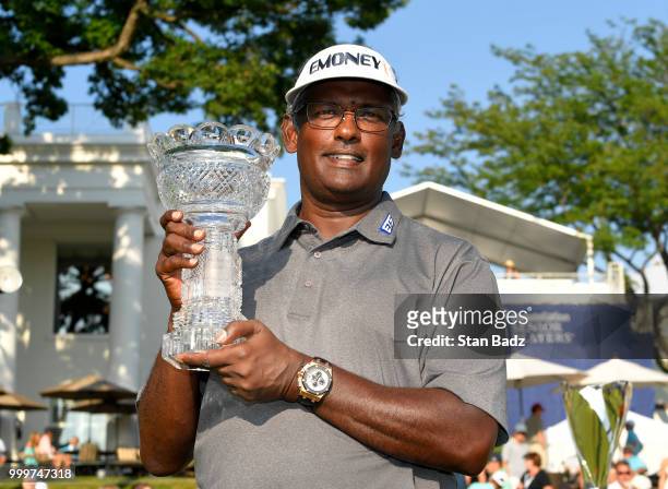 Vijay Singh poses with the winner's trophy after beating Jeff Maggert in a two hole playoff during the final round of the PGA TOUR Champions...