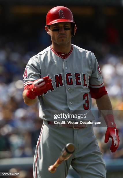 Ian Kinsler of the Los Angeles Angels of Anaheim tosses his bat after striking out swinging with the bases loaded in the seventh inning during the...