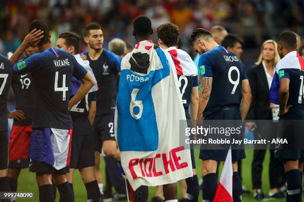 Paul Pogba of France draped in a flag with himself on during the 2018 FIFA World Cup Russia Final between France and Croatia at Luzhniki Stadium on...