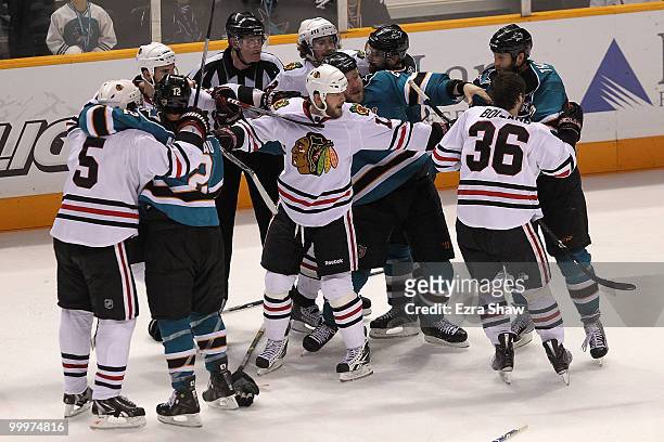 John Madden of the Chicago Blackhawks attempts to break up a fight during the third period while taking on the San Jose Sharks in Game Two of the...
