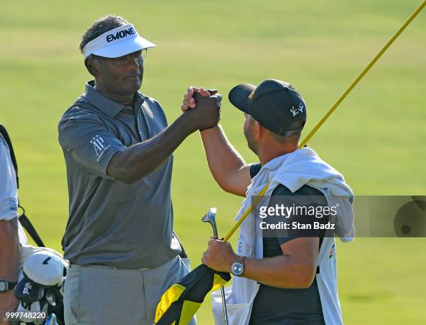Vijay Singh and his caddie Danny Sahl celebrate their win after beating Jeff Maggert in a two hole playoff during the final round of the PGA TOUR...