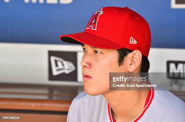 Los Angeles Angels pitcher Shohei Ohtani looks on from the dugout during a MLB game between the Los Angeles Angels of Anaheim and the Los Angeles...