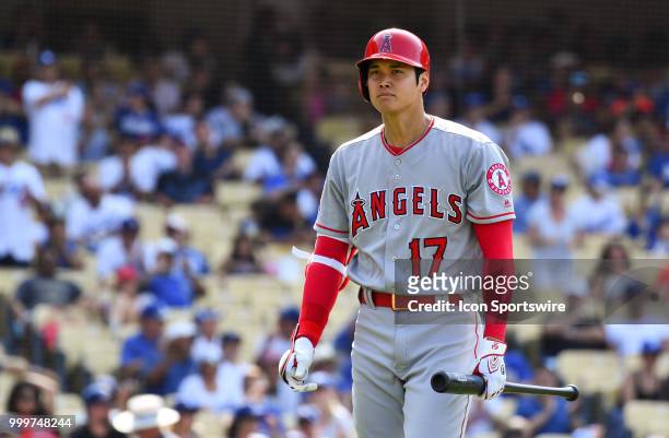 Los Angeles Angels pinch hitter Shohei Ohtani walks back to the dugout after striking out in the 9th inning during a MLB game between the Los Angeles...