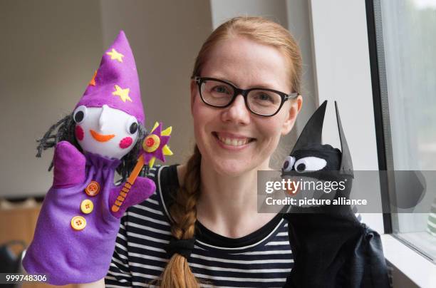 Kati Hyyppaei from Finland sits in the room of a refugee home in Berlin, Germany, 6 September 2017. Hyyppaei voluntarily offers sewing courses for...