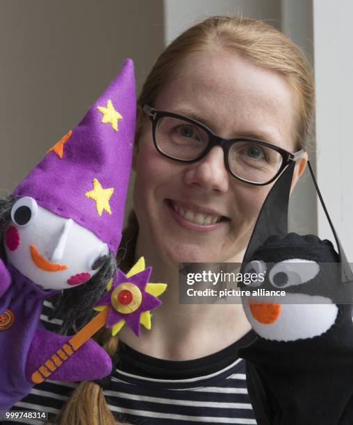 Kati Hyyppaei from Finland sits in the room of a refugee home in Berlin, Germany, 6 September 2017. Hyyppaei voluntarily offers sewing courses for...