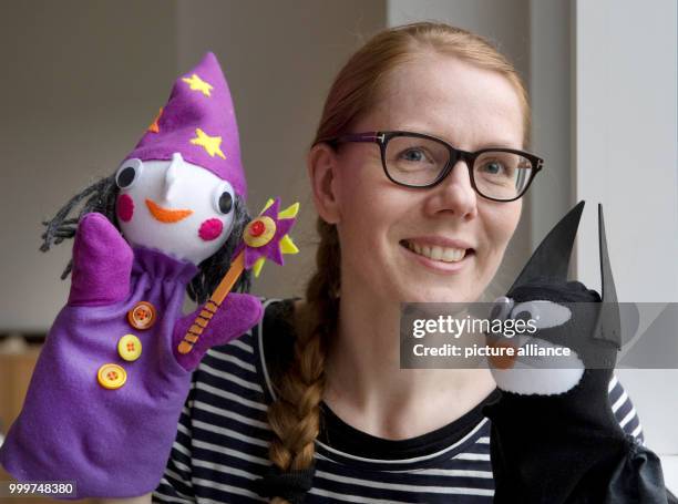 Kati Hyyppaei from Finland sits in the room of a refugee home in Berlin, Germany, 6 September 2017. Hyyppaei voluntarily offers sewing courses for...