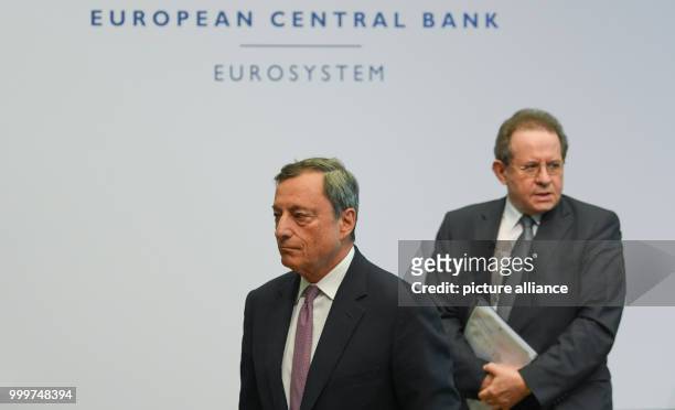 Mario Draghi , president of the European Central Bank , and his deputy Vitor Constancio arrive at a press conference at the bank's headquarters in...