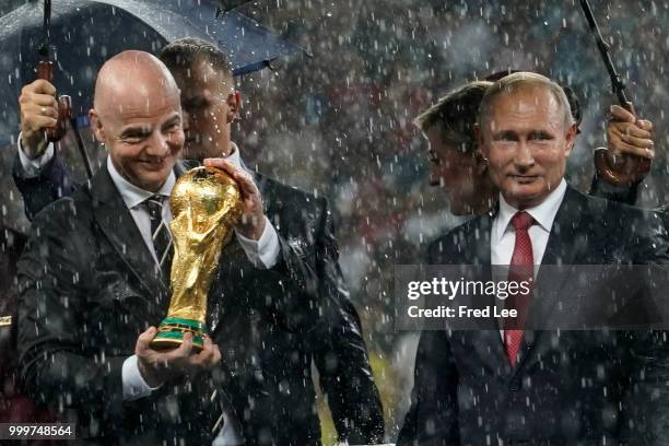 Russian President Vladimir Putin and FIFA President Gianni Infantino attend the award ceremony of the 2018 FIFA World Cup Russia Final between France...