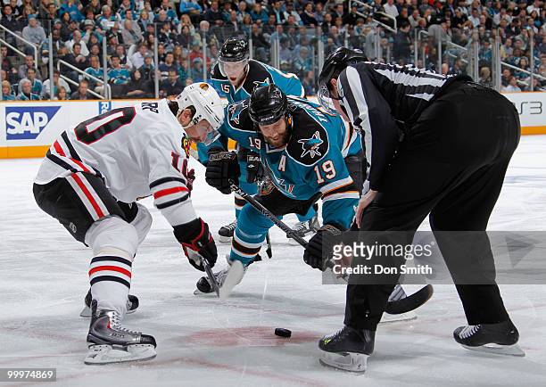 Patrick Sharp of the Chicago Blackhawks, faces off with Joe Thornton of the San Jose Sharks in Game Two of the Western Conference Finals during the...