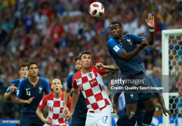 Paul Pogba of France competes for the ball with Mario Mandzukic of Croatia during the 2018 FIFA World Cup Russia Final between France and Croatia at...