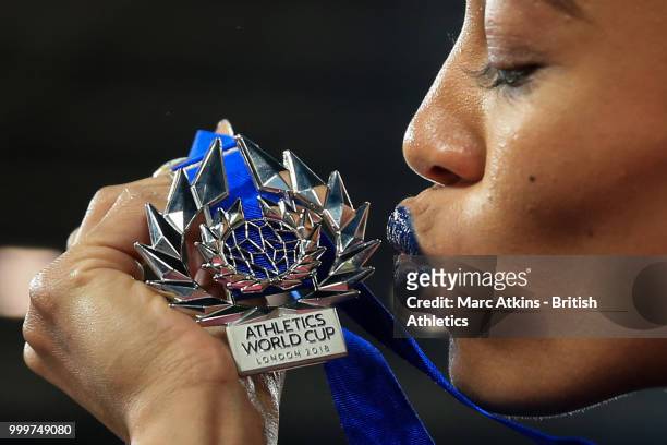 Captain Queen Harrison kisses her medal as Team USA celebrate victory during Day Two of the Athletics World Cup 2018 presented by Muller at London...