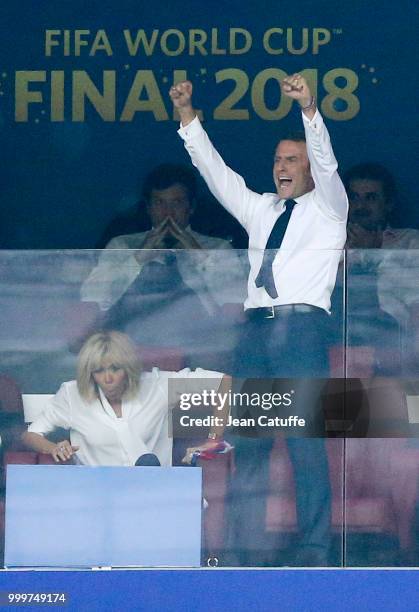 President of France Emmanuel Macron celebrates a goal for France while his wife Brigitte Macron looks on during the 2018 FIFA World Cup Russia Final...