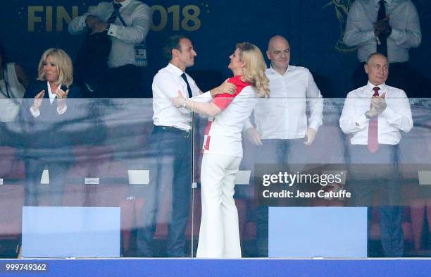 President of France Emmanuel Macron greets President of Croatia Kolinda Grabar-Kitarovic after the victory while his wife Brigitte Macron, FIFA...