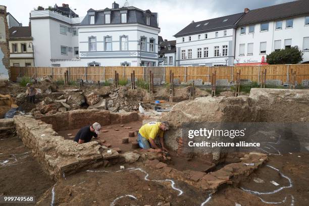 Researchers dig up a Roman floor heating system at an excavation site in Remagen, Germany, 7 September 2017. During the excavations, human bones were...