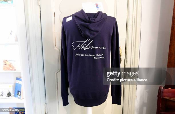 The signature of Storm and a quote of Thomas Mann are printed on a hoodie for sale at the birth house and residence of Theodor Storm in Husum,...