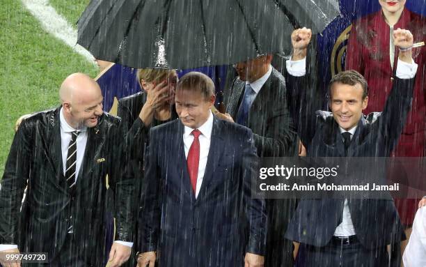 Russian President Vladimir Putin , French President Emmanuel Macron and FIFA President Gianni Infantino attend the award ceremony of the 2018 FIFA...